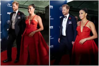 Gosh! Meghan Markle Returns to Red Carpet With Prince Harry in a Fiery Red Gown With Plunging Neckline