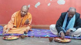 CM Yogi ने दलित के घर भोजन किया, बोले- भ्रष्टाचार जिनके जीन्स में हो, वे सामाजिक न्याय की लड़ाई नहीं लड़ सकते