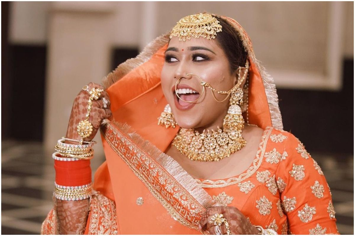 This Bride Wears Her Bridal Red Saree With a Giant Leather Belt