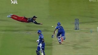 Cricket news cricket news rcb vs mi ipl 2022 glenn maxwell superman like dive helps tilak verma run out watch video 5329257