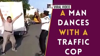 Traffic Cop Viral Video: Shocking Traffic Cop Breaks Rule, Dances With a Man on Road