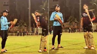 Cricket news rcb vs gt virat kohli gift a bat to rashid khan watch video 5400298