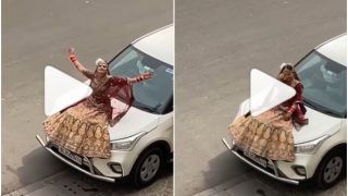 Viral Video: Filmy Bride Sits Atop Moving Car, Proposes to Groom in Shah Rukh Khan Style | Watch