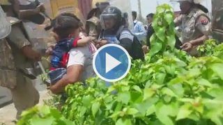 Agnipath Protests: Man Holding Child Runs For Safety Amid Stone Pelting in Mathura. Watch Video