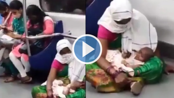 Viral Video: Woman Holding Baby Seen Sitting on Floor in Delhi Metro, Twitter Is Enraged | Watch