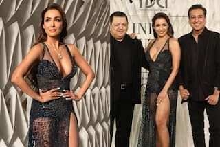 मलाइका अरोड़ा ने ब्लैक ट्रांसपैरेंट गाउन में दिखाया अपना फिगर, डीप नेक में किया रैंप वॉक...तो फैंस ने भरी आहे