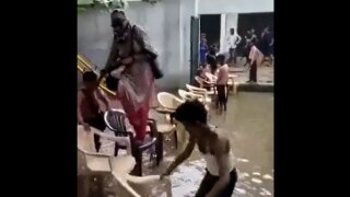 Teacher Enters Flooded School As Students Hold Chairs | WATCH