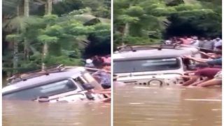 Jeep Gets Stuck on Road After Heavy Rains Lash Kannur, Locals Try To Pull It Out | Watch