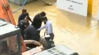 Bengaluru Rains: Security Guards Rescue Man Stuck On Waterlogged Road | Watch Video
