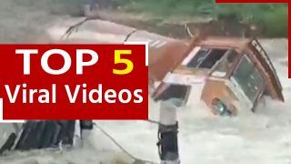 Viral Video: पानी की तेज बहाव में तिनके की तरह बहा ट्रक, देखें वीडियो