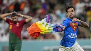 Protester With Rainbow Flag Runs Onto Field At FIFA World Cup