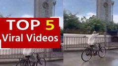 Viral Video: बुजुर्ग ने साइकिल पर किया खतरनाक स्टंट, वीडियो देख हिल जाएगा आपका दिमाग | Watch Video