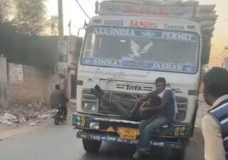Thief Tries To Steal From Truck, Driver Ties Him To Bonnet Enroute Punjab Police. Watch Viral Video