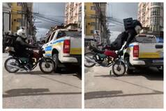Biker Crashes Into Pick-Up Truck At High Speed, Saved By Truck Itself: Watch