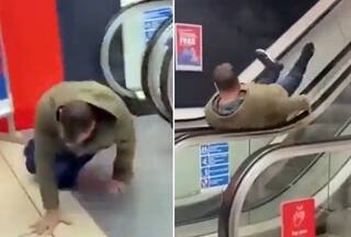 Man Enjoys Spinning On Escalator Railings Like A Kid: Watch