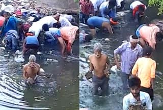 People Jump Into Drain In Bihar To Collect Rolls Of Currency Notes: Watch