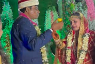 Viral Video Shows Groom Forcibly Feeding Laddoo To Bride As Guests Cheer