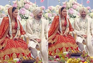Karan Deol   s Bride Drisha Acharya Stuns in a Classic Red Sabyasachi Lehenga With Deep-Neck Blouse - Check Full Look