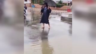 Watch: Kashmir Cop Manages Traffic Barefoot Amid Heavy Downpour In Srinagar, Wins Hearts