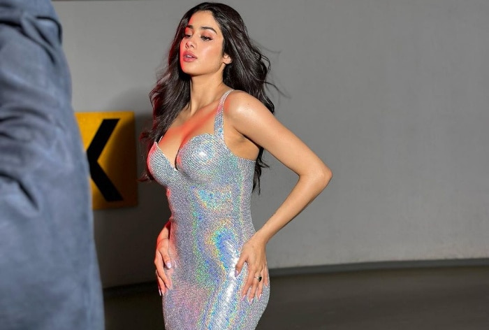 PICS: Janhvi Kapoor oozes oomph in silver deep-neck blouse and matching  saree