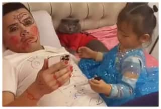 Little Girl Uses Dad’s Face And T-Shirt As Canvas, Watch The Result