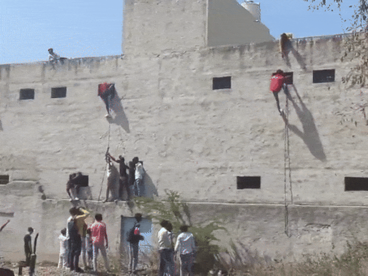 Move Over Spider-Man! People Scale School Building To Help Students Cheat In Haryana Board Exams | WATCH
