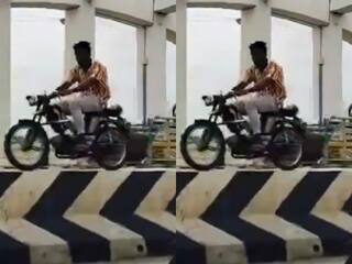 Stunt Ka Video: सड़क पर लगे जाम को बर्दाश्त ना कर सका लड़का, डिवाइडर पर दौड़ा दी बाइक | देखें वीडियो