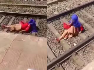 Premika Ka Video: बॉयफ्रेंड से बात करते हुए ट्रेन के नीचे आ गई प्रेमिका, जिंदा बची तो फोन से फिर चिपक गई- देखें वीडियो