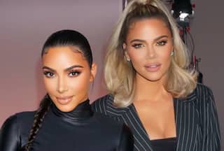 Kim and Khloe Kardashian Touch Down in Mumbai Ahead of Anant -Radhika's Wedding - WATCH