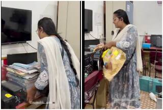Like It's Nothing! Watch Woman Casually Catches Giant Snake Bare-Handed At Crowded Office