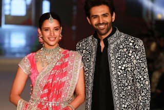 Triptii Dimri-Kartik Aaryan share unmissable chemistry as they walk the ramp in gulabi brocade lehenga and stylish black bandhgala - Watch video