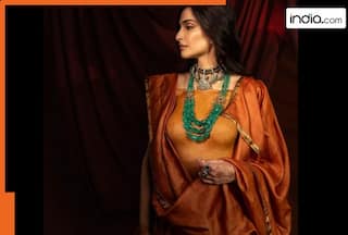 Sonam Kapoor's styles orange lehenga not with a blouse but this mind blowing body ornament that is made of...