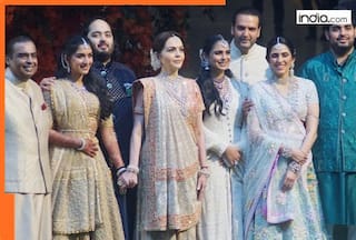 Mukesh Ambani, Nita Ambani’s sons Akash Ambani, Anant Ambani following their father as they....