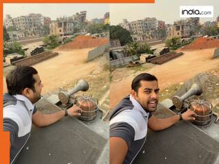 रील बनाने के लिए चलती ट्रेन की छत पर लेट गया शख्स, Viral Video देख लोग रह गए दंग | देखें वीडियो