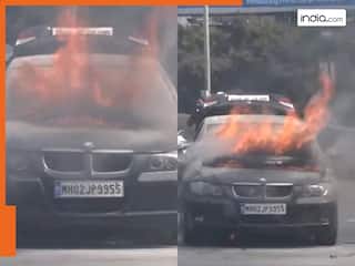 बीच सड़क पर आग का गोला बनी BMW कार, कुछ ही मिनटों में हुई खाक । देखें VIDEO