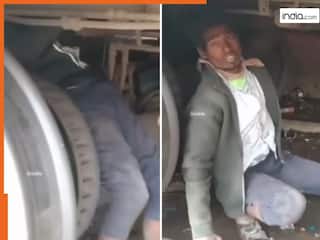 Train Ka Video: ट्रेन कोच के नीचे लटककर शख्स ने की लंबी यात्रा, नजर पड़ते ही उड़ गए सबके होश | देखें वीडियो