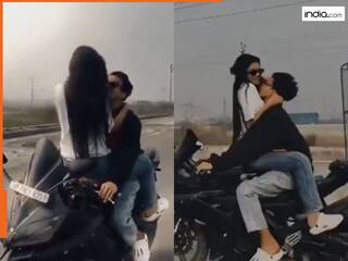 Viral Video: चलती बाइक पर कपल का खतरनाक स्टंट, फ्यूल टैंक पर बैठी लड़की लगी झूमने, एक्शन नें पुलिस