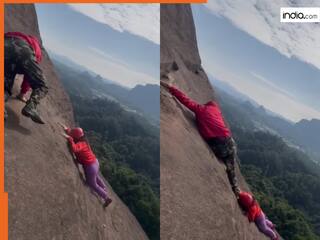 Ladki Ka Video: अचानक पहाड़ से फिसलकर गिरने लगी लड़की, बचाने गया शख्स भी पड़ गया आफत में | देखें वीडियो