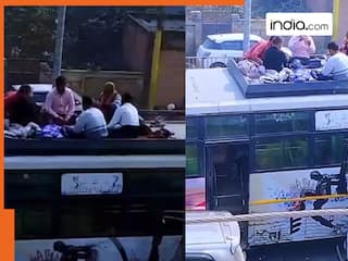 Viral Video: महाकुंभ के कारण लगा था जाम, बस की छत पर बैठ लगा लिया टाइमपास का तगड़ा जुगाड़ | देखें वीडियो