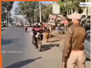 Challan Ka Video: चालान काटने के लिए दौड़कर आया पुलिसकर्मी, मगर बाइक देखते ही तोते उड़ गए | देखें वीडियो