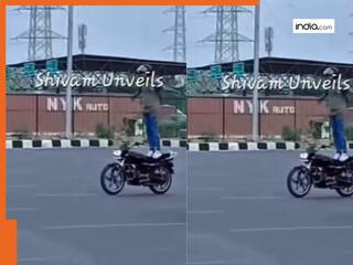 Stunt Ka Video: मौत को छूकर टक से वापस लौट आया बाइकर, स्टंट का खतरनाक वीडियो हुआ सोशल मीडिया पर वायरल | देखें वीडियो