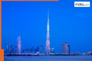 Which is world's most beautiful building? It is built on 42 acres, attracts millions of tourists every year, it is..., located in..., not Burj Khalifa in Dubai