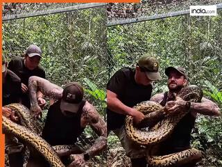 Anaconda Attack Video: हाथों से एनाकोंडा को पकड़ना पड़ा महंगा, सांप ने शरीर में कसकर ऐसा जकड़ा कि निकल गई चीख | देखें वीडियो