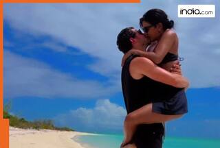 Priyanka Chopra leaps into Nick Jonas for passionate lip kiss on beach in black bikini - Watch viral video