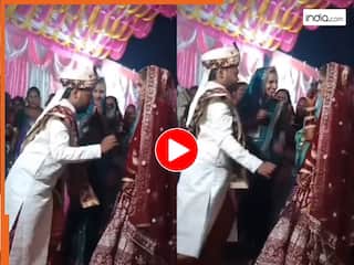 Bride Groom Video: स्टेज पर दुल्हन को ब्रेक डांस दिखाने लगा दूल्हा, हरकत देख मेहमान भी हंस पड़े | देखें वीडियो