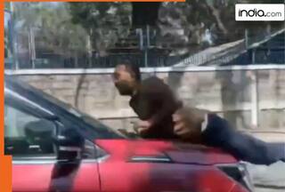 Bengaluru road Rage: SUV driver drives car for a kilometer with a man hanging on the bonnet | Video goes viral