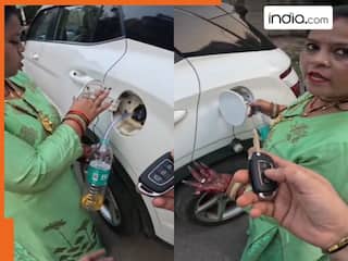 Viral Video: कार से पेट्रोल चुराने लगी स्कूटी वाली आंटी, मालिक आया तो उसे ही चोर बता दिया | देखें वीडियो