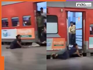 Viral Video: Woman risks life, falls twice before climbing onto moving Delhi-Agra train - Netizens react in shock
