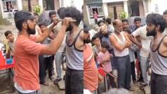 Viral Video: चोरी के शक में आदमी को बिजली के खंभे से बांध दिया, फिर रॉड और डंडों से पीटने लगे लोग