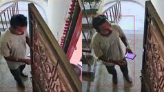 Watch: Delivery agent allegedly tries to step inside customer's home; CCTV footage goes viral